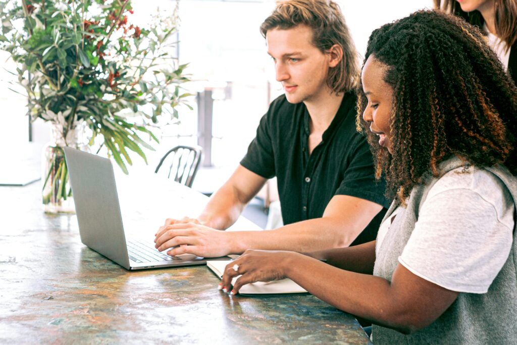 Young professionals collaborating on a project in a modern office space.